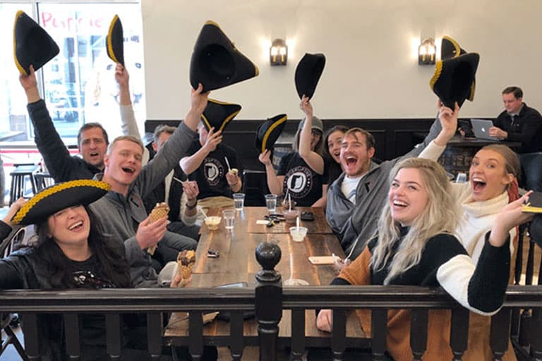 Smiling customers with ice cream and Tricorn Hats at Brooker's Founding Flavors Ice Cream